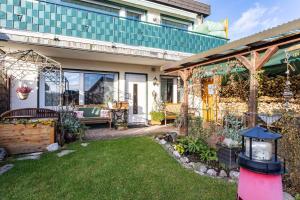 a home with a garden with a patio at Ferienoase Balve in Balve
