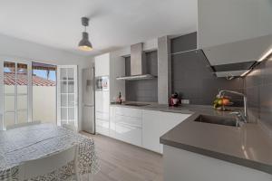 a kitchen with a sink and a counter top at Casa el Jable in Guía de Isora