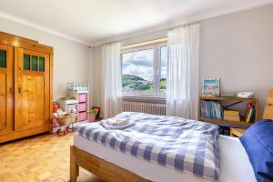 a bedroom with a bed and a window at Ferienwohnung Lammerberg in Albstadt