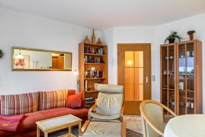 a living room with a couch and a table at Ferienwohnung Tannenblick 3-1 in Oberhof