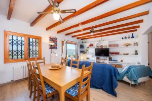 a kitchen and dining room with a table and chairs at Sa Torreta Luxury Views 3 Bedrooms in Sóller