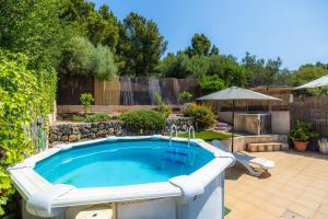 a swimming pool in a yard with a fence at Sa Torreta Luxury Views 3 Bedrooms in Sóller