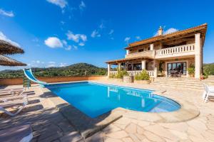 an image of a villa with a swimming pool at Turó de na Roca in S'Horta