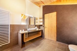 a bathroom with a sink and a toilet at Huetterhof Apartement Herbischt in Caines +14 photos