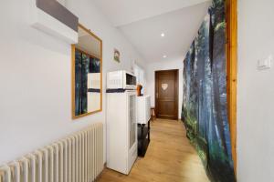 a room with a radiator and a painting on the wall at Affittacamere Angelina in San Pietro di Cadore