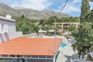 an overhead view of a building with an orange roof at Ilias Voula Studios in Kalymnos
