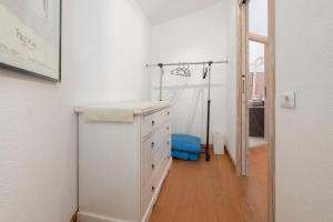 a bathroom with a white dresser and a mirror at Seahouserent in Cannigione +18 photos
