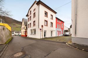 an empty street in a town with buildings at Adlernest mit Weinbergblick in Trittenheim
