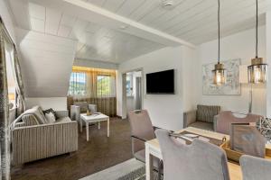 a living room with a couch and a table at Landhaus Kramer Meine Cardplus inkl in Willingen