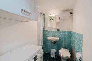 a small bathroom with a toilet and a sink at Ai Cannola - Calatafimi Segesta in Calatafimi +34 photos