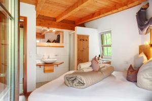 a bedroom with a large white bed in a room at Ferienhaus Plattner in Oetz