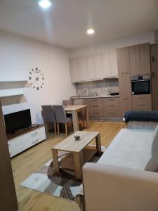a living room with a couch and a table at Stan na dan in Svilajnac