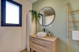 a bathroom with a sink and a mirror at Villa Mézoise in Mèze +19 photos