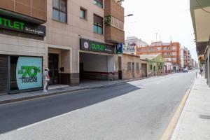 a person standing on the side of a city street at Apolo66-3 in Torrevieja