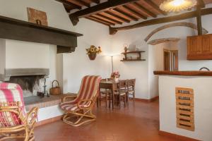 a kitchen and dining room with a table and chairs at Universal Harmony - Capinera in Dicomano