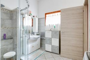 a bathroom with a shower and a sink at Casa Rosa in Fluminimaggiore +19 photos