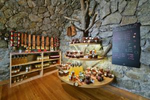 a wine store with a bunch of bottles on display at Birkenhof - Wohnung Ortler in Sluderno +38 photos
