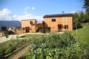 a house on a hill with a garden at Landhaus Silene in Sarnonico