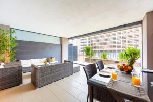 an apartment patio with a table and chairs at Sofie apartamento turístico in Roquetas de Mar