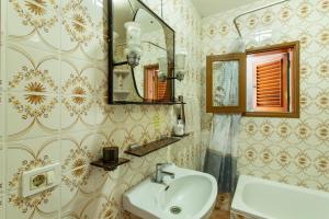 a bathroom with a sink and a mirror at Villa Alejo in Valsequillo +17 photos