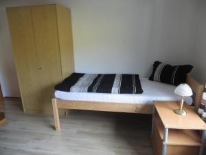 a bedroom with a bed with a wooden bed frame at Waldblick in Gellersen