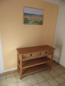 a wooden table in the corner of a room at Waldblick in Gellersen +2 photos