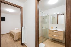 a bathroom with a glass door leading to a bedroom at La Tavernetta di Elisa in Calimera