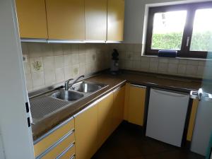 a small kitchen with a sink and a window at Ferienwohnung Schwendemann in Laichingen