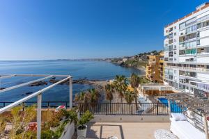 a view of the ocean from the balcony of a building at Dúplex Paradise above the sea in Benalmádena