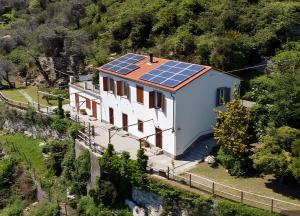 an image of a house with solar panels on the roof at Fattorialmare Rossa in Camogli