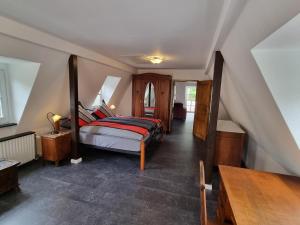 a bedroom with a bed in a attic at Traum-Fewo Mosel-Panoramablick in Traben-Trarbach