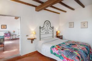 a bedroom with a large bed in a room at Universal Harmony - Cardellino in Dicomano +23 photos