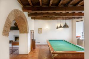 a pool table in the middle of a room at Universal Harmony - Cardellino in Dicomano