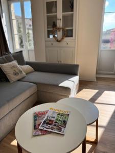 a living room with a couch and a coffee table at Détente et vue exceptionnelle à L'appart' de Charles in Dole