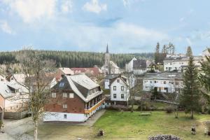 a group of buildings in a town with a church at Ferienwohnung Nina in Schönwald