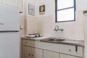 a kitchen with a sink and a window at Perasma Studio 3 in Kipri +12 photos