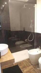 a bathroom with a white sink and a shower at Appartamento Luxury - Torre in Terracina