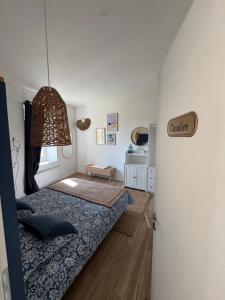 a small bedroom with a bed and a window at Détente et vue exceptionnelle à L'appart' de Charles in Dole