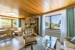 a living room with a wooden ceiling at B463 Penthouse in Albstadt
