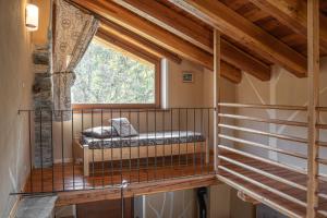 a room with a balcony with a window at Civico 9 in Marmora