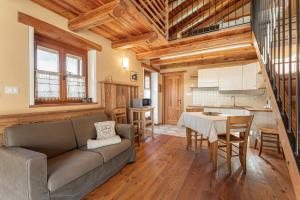 a living room with a couch and a table at Civico 9 in Marmora