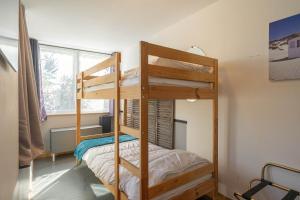 a bedroom with two bunk beds and a window at Les gîtes du logis in Saint-Romain-de-Benet +62 photos