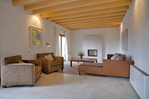 a living room with two couches and a table at Son Puca 1 in Búger