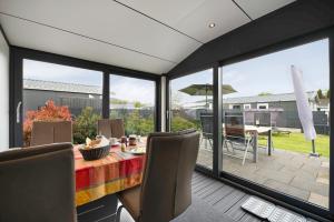 a dining room with a view of a patio at Haus Ferdi in Koblenz