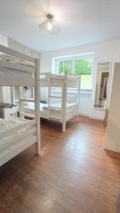 a bedroom with two bunk beds and a window at Sublime Chalet 14 Pers Spa Extrieur in Cauterets