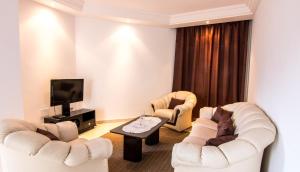 TV a/nebo společenská místnost v ubytování Mahdia Place Apartments