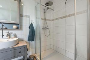 a bathroom with a shower and a sink at Fehrsland 2 in Dollerup +31 photos