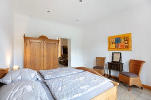 a bedroom with a bed and a table and chairs at Ferienwohnung Bestensee in Bestensee