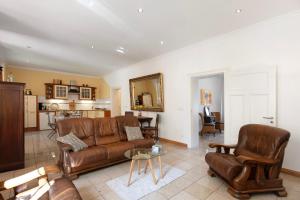 a living room with a couch and a table at Ferienwohnung Bestensee in Bestensee +23 photos
