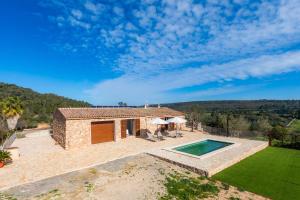 an external view of a house with a swimming pool at Can Jaume in Manacor